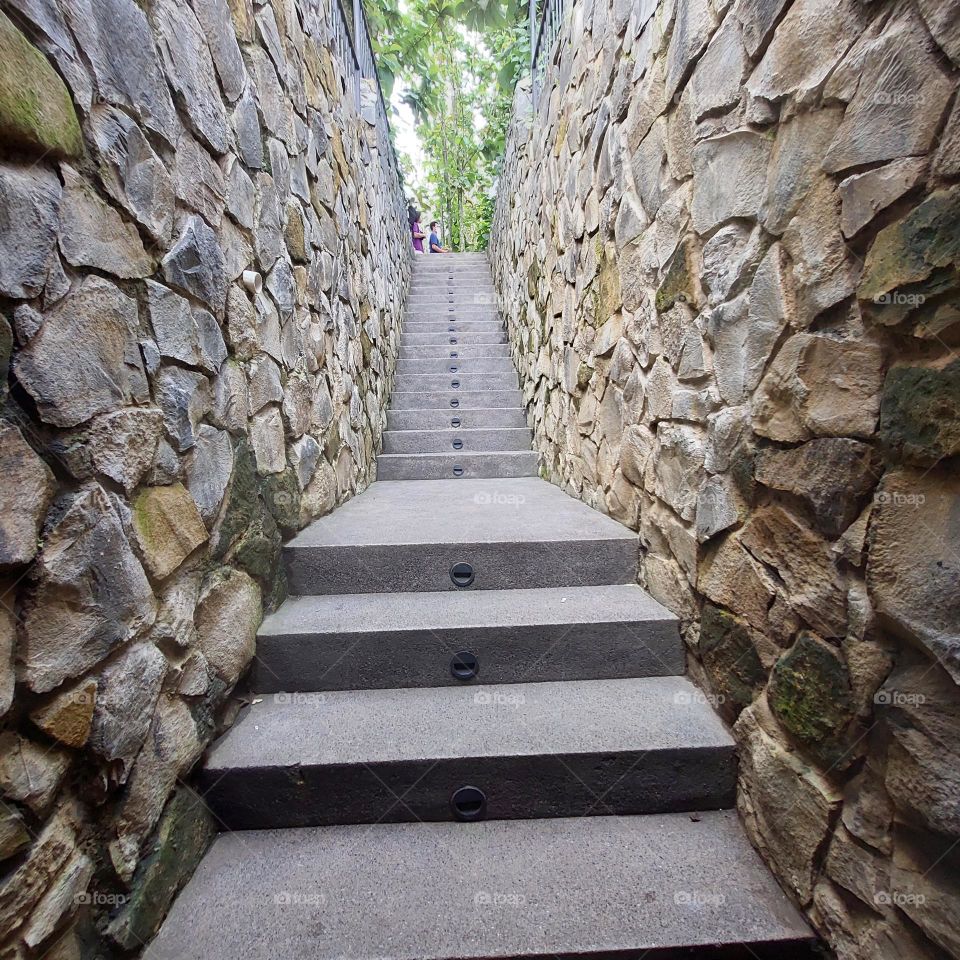 Unique stairs to the cafe with stone walls