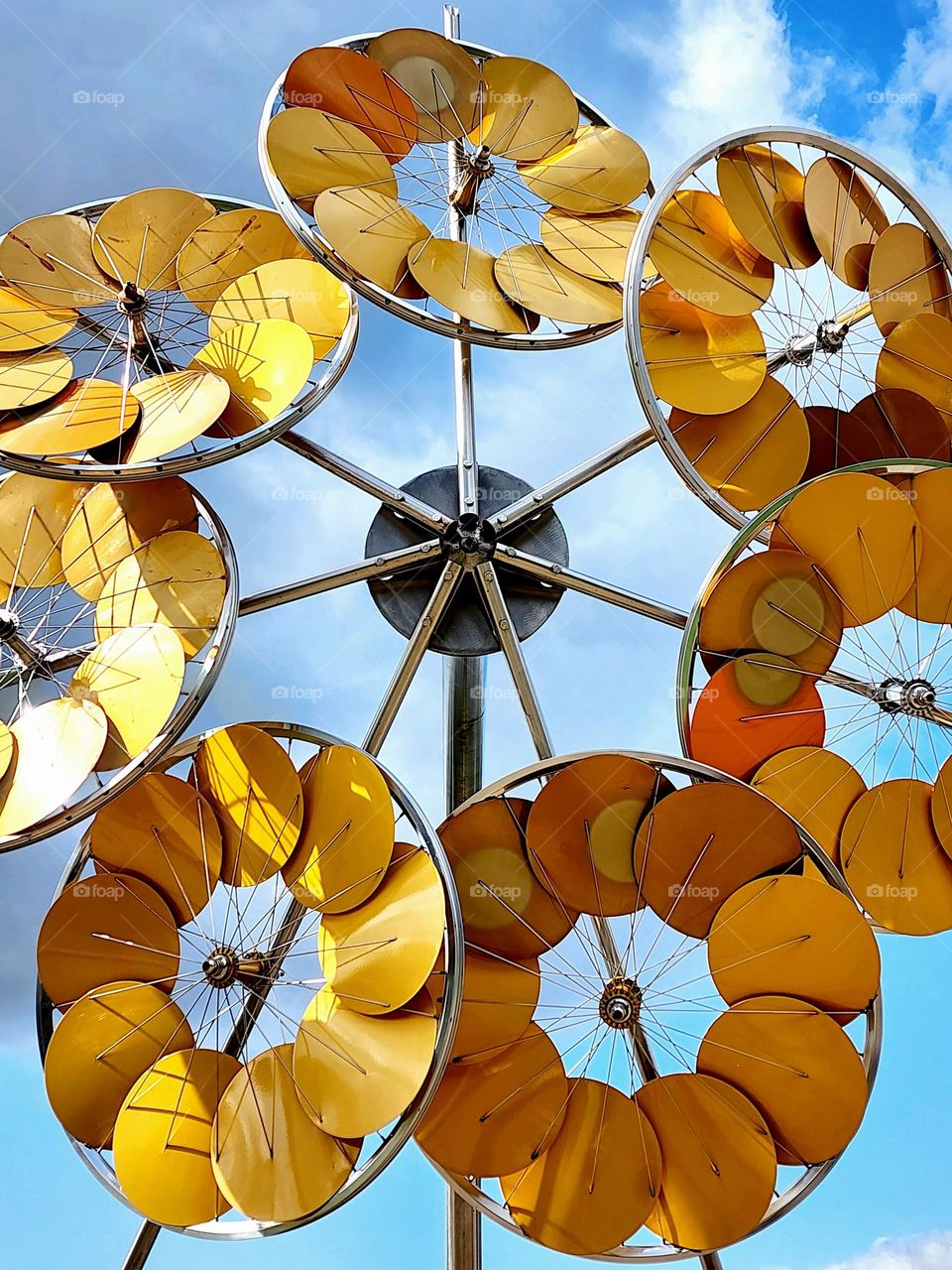 Large yellow circular sun shades create an interesting piece of street art in a downtown area