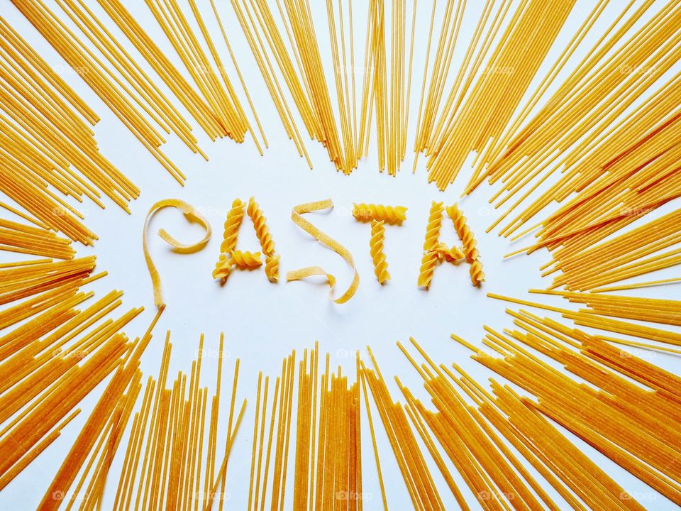written pasta on spaghetti background