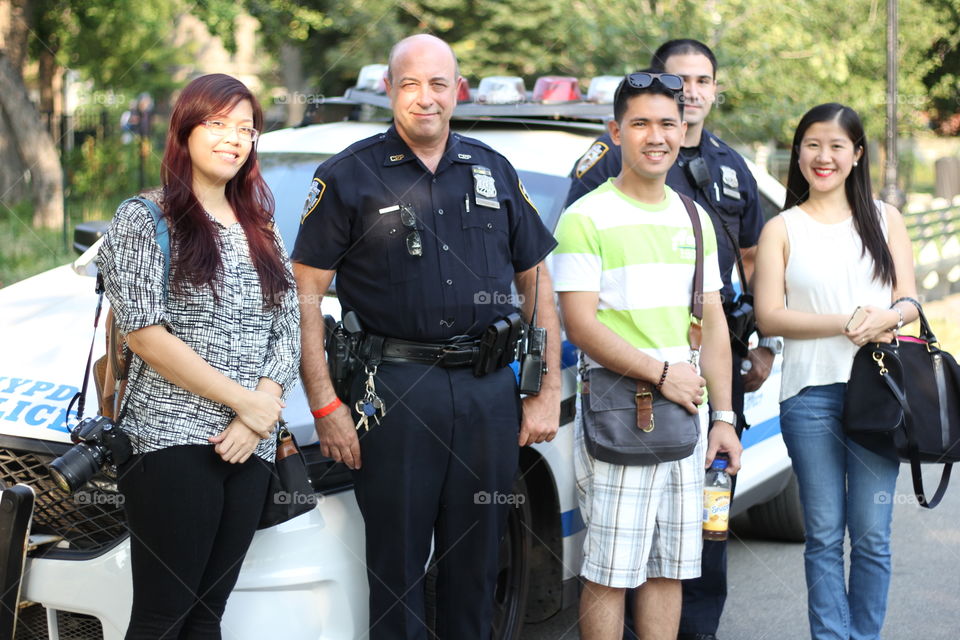 Mug shot with the officers . First day in NYC and my friends are already being targeted by NYPD 