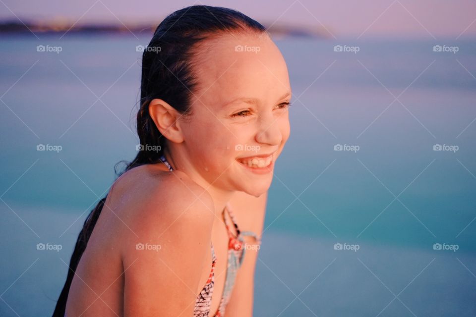 Smiling girl enjoying the seaside 