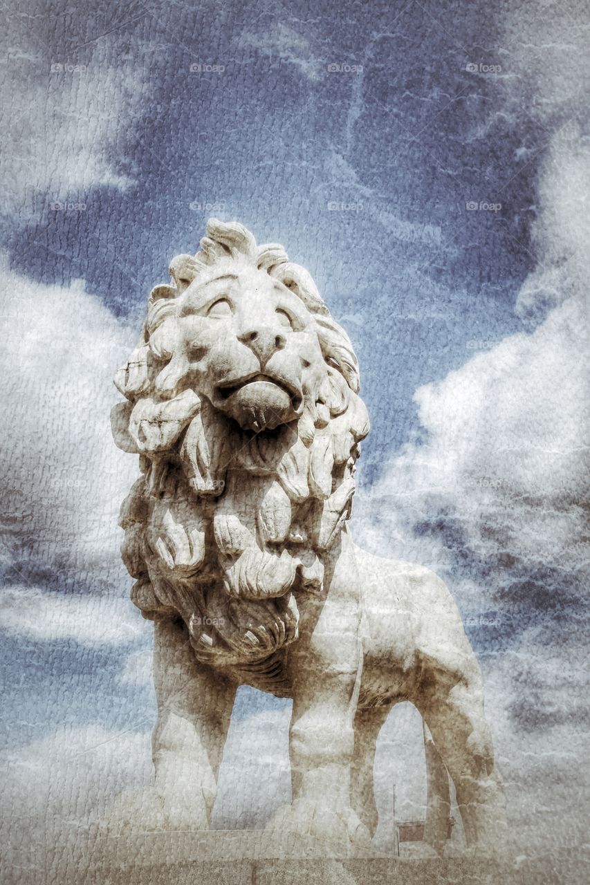 Proudly Lion. A lion statue standing proudly with a textured finish.