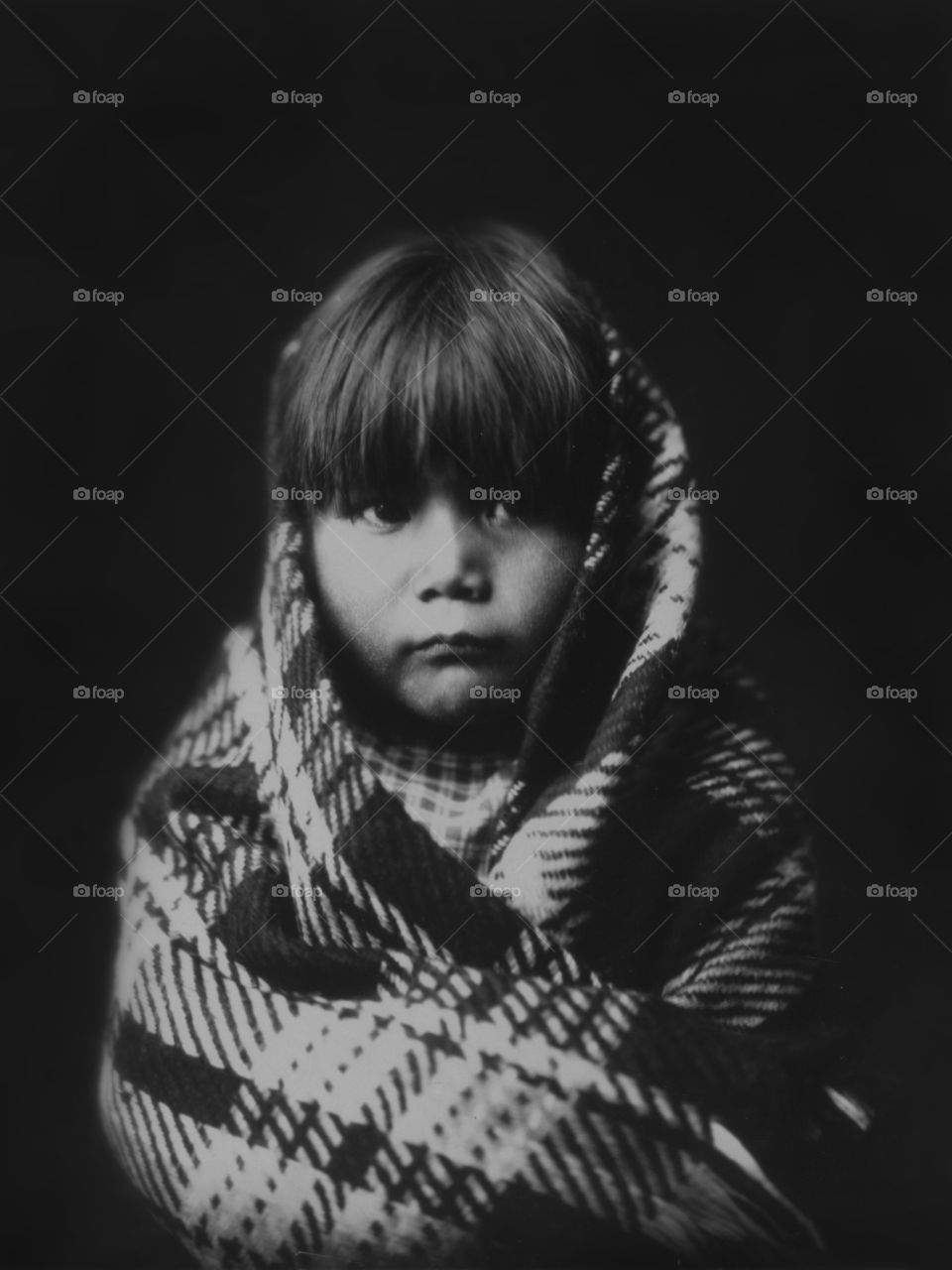 Navajo child photographed circa 1904 by Edward Curtis.