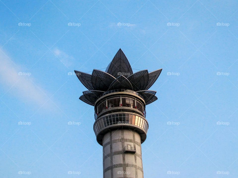 Low angle view of tower against blue