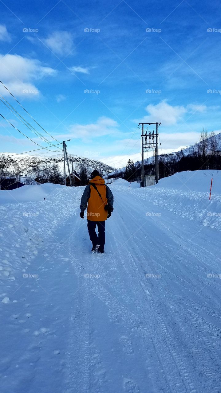 Walking the snowy road