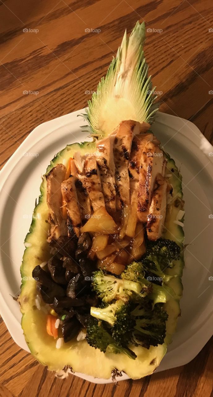 Dinner - grilled chicken, roasted mushrooms & broccoli with sautéed pineapple stuffed in fresh pineapple 