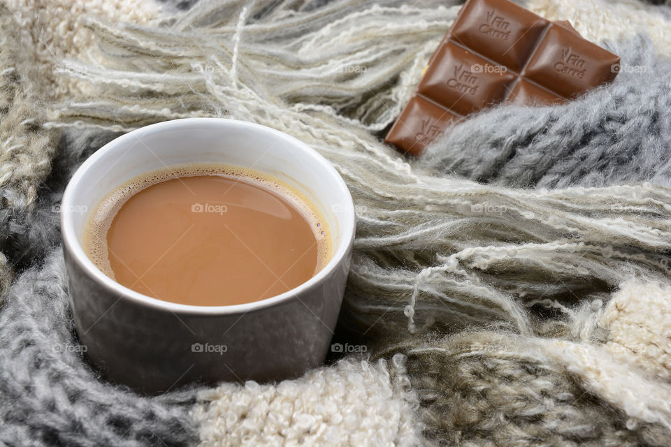 hot chocolade coffee in a warm woolen blanket sjawl