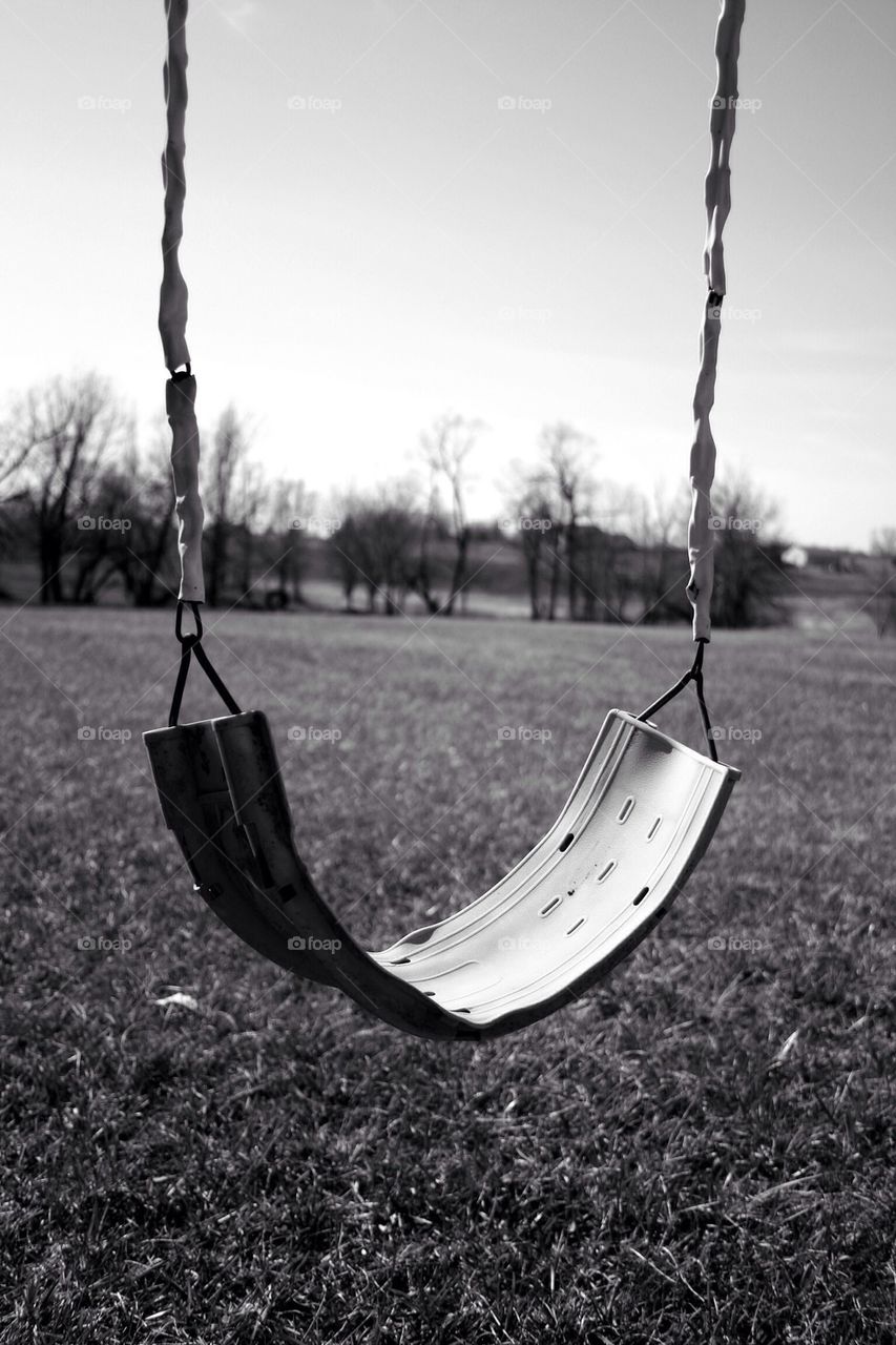 Close-up of empty swing