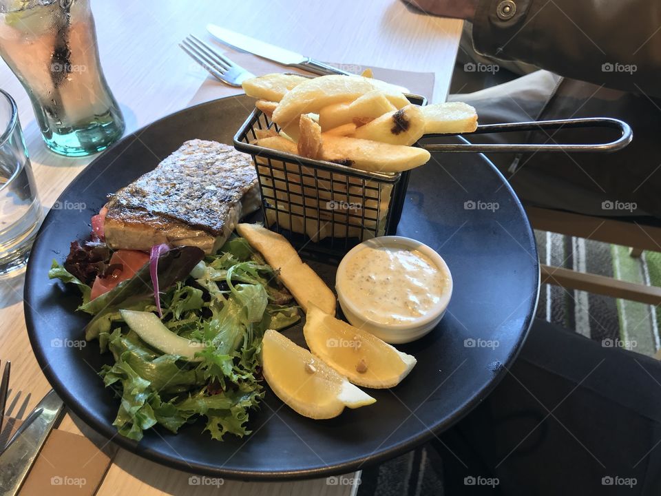 Freshwater Barramundi: Grilled Barramundi served with chips, house salad, tartare sauce and lemon at Cheltenham RSL Melbourne Australia 