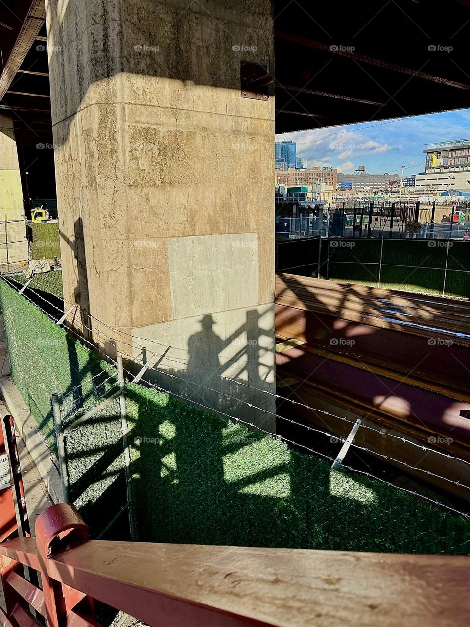 These intricately interwoven shadows result when looking at the structures of the “Pulaski Bridge” at “Newtown Creek” from the top of the staircase that leads to the pedestrian lane on the “Greenpoint”, Bklyn side. 2023. Hypnotic Productions