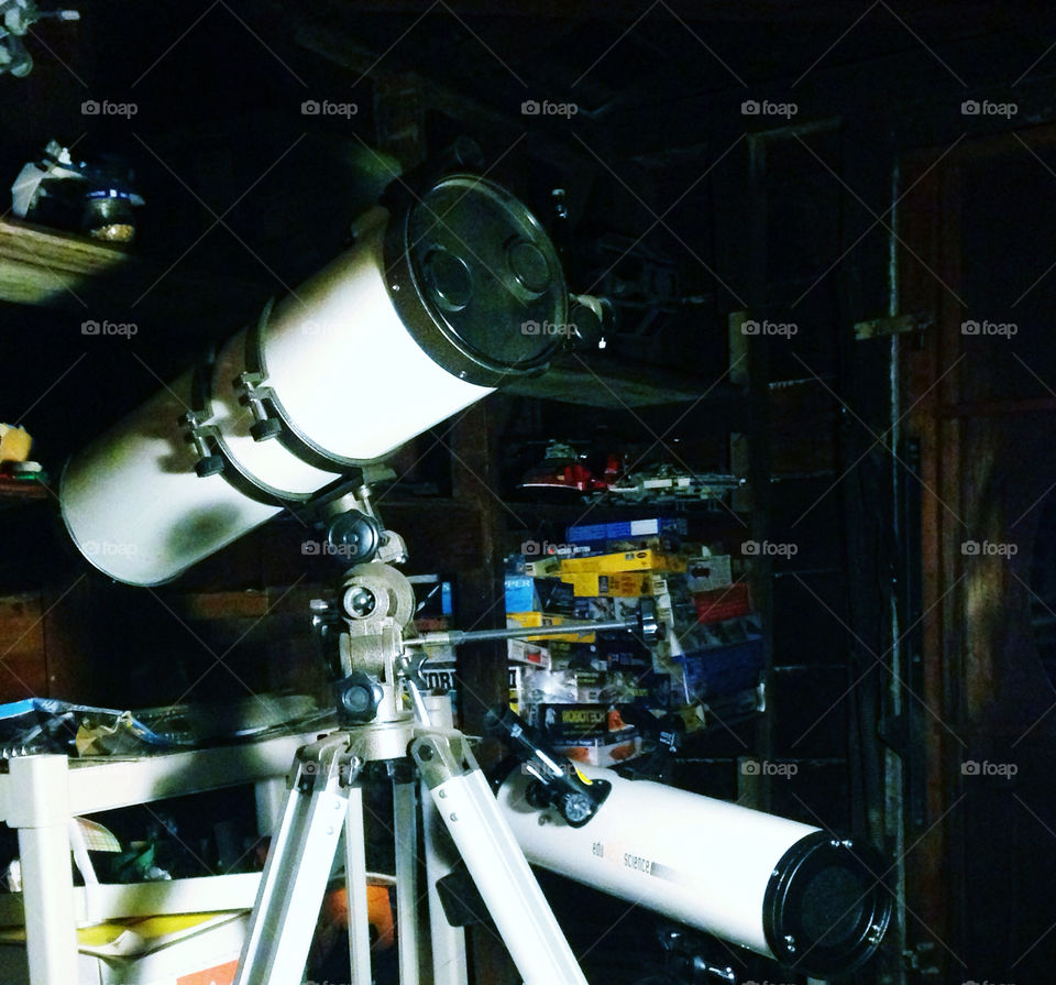 Two telescopes in a garage