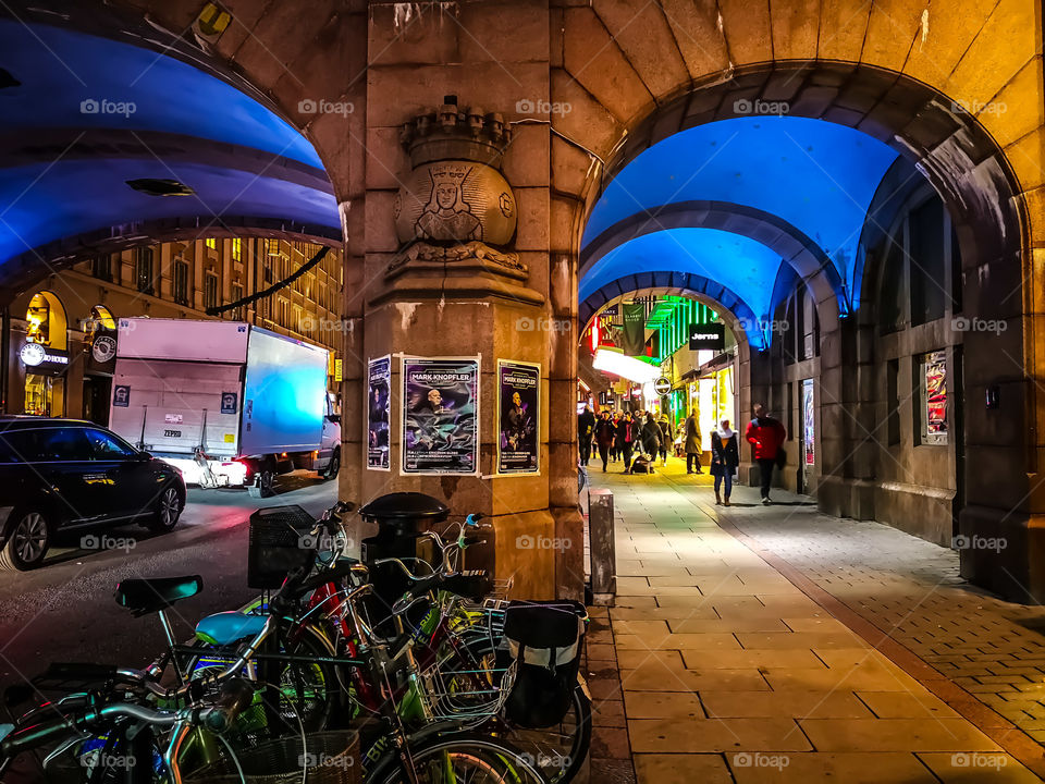 Walking under the bridge at night.
