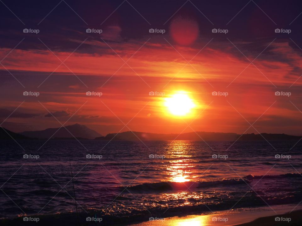 Sun goes down in the sea of Bagnoli ( Naples - Italy ).