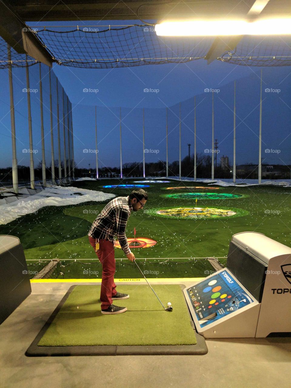 playing golf at top golf