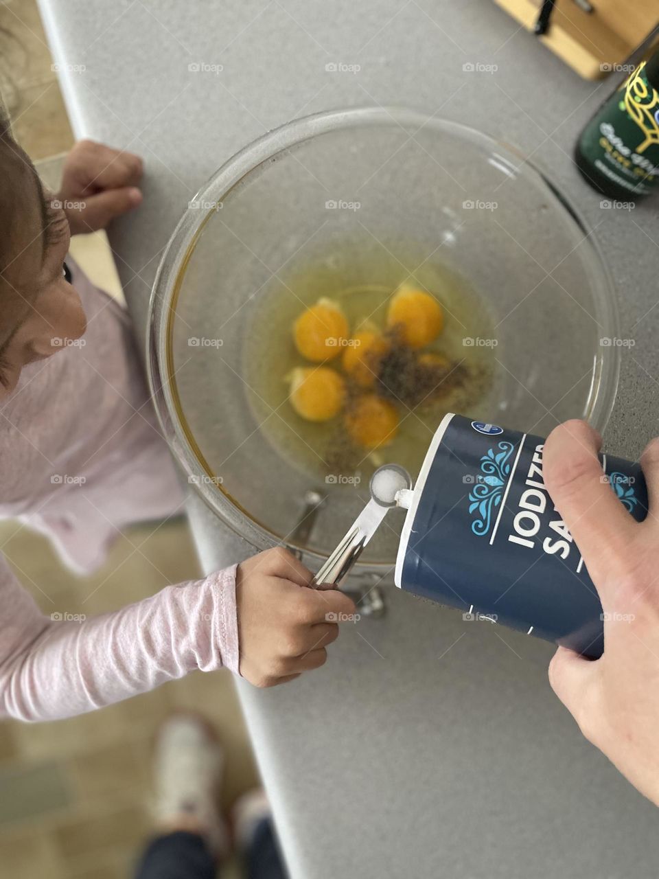 Toddler helps mother cook, making potato frittata, cooking with mommy, mommy’s little helper 