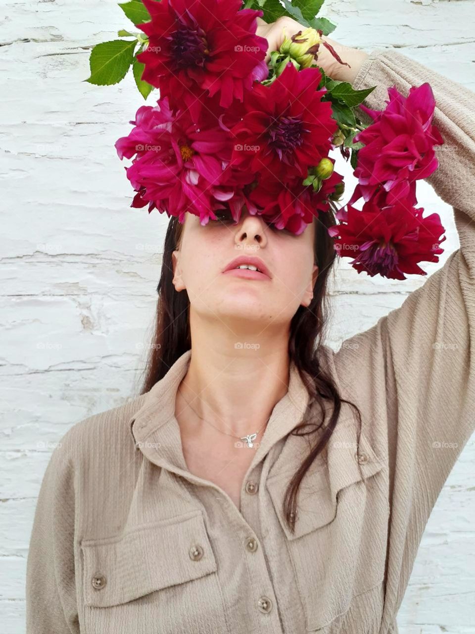 Blooming portrait of a girl in viva magenta color