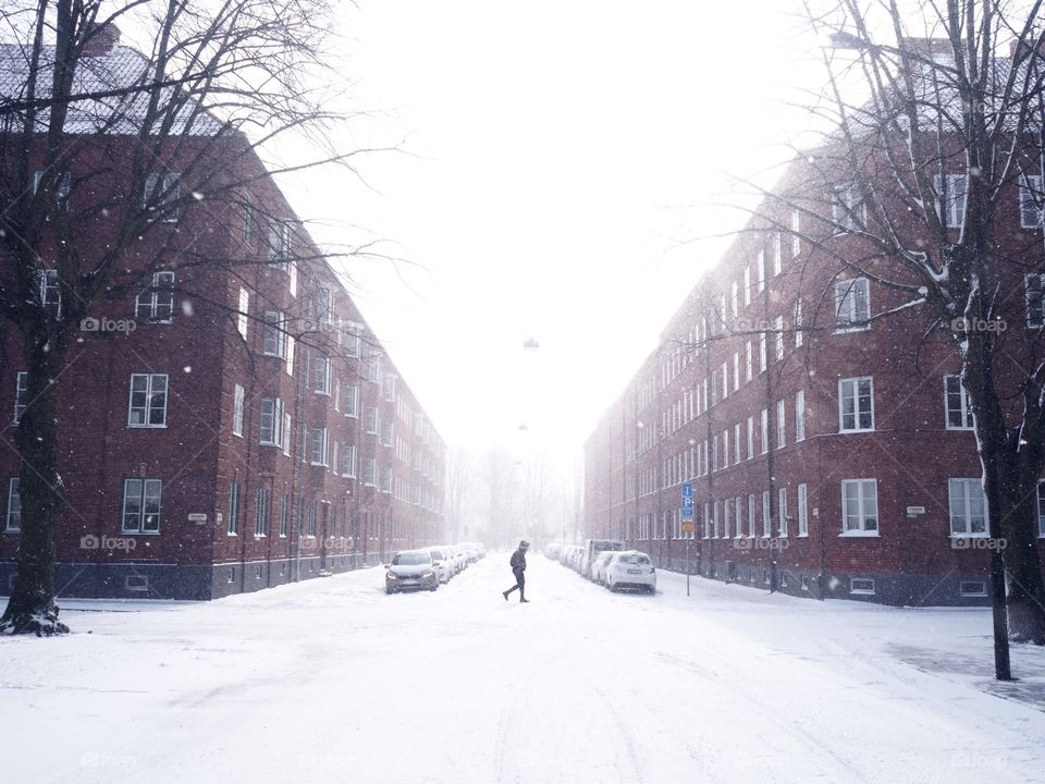 Person walking a street in winter 