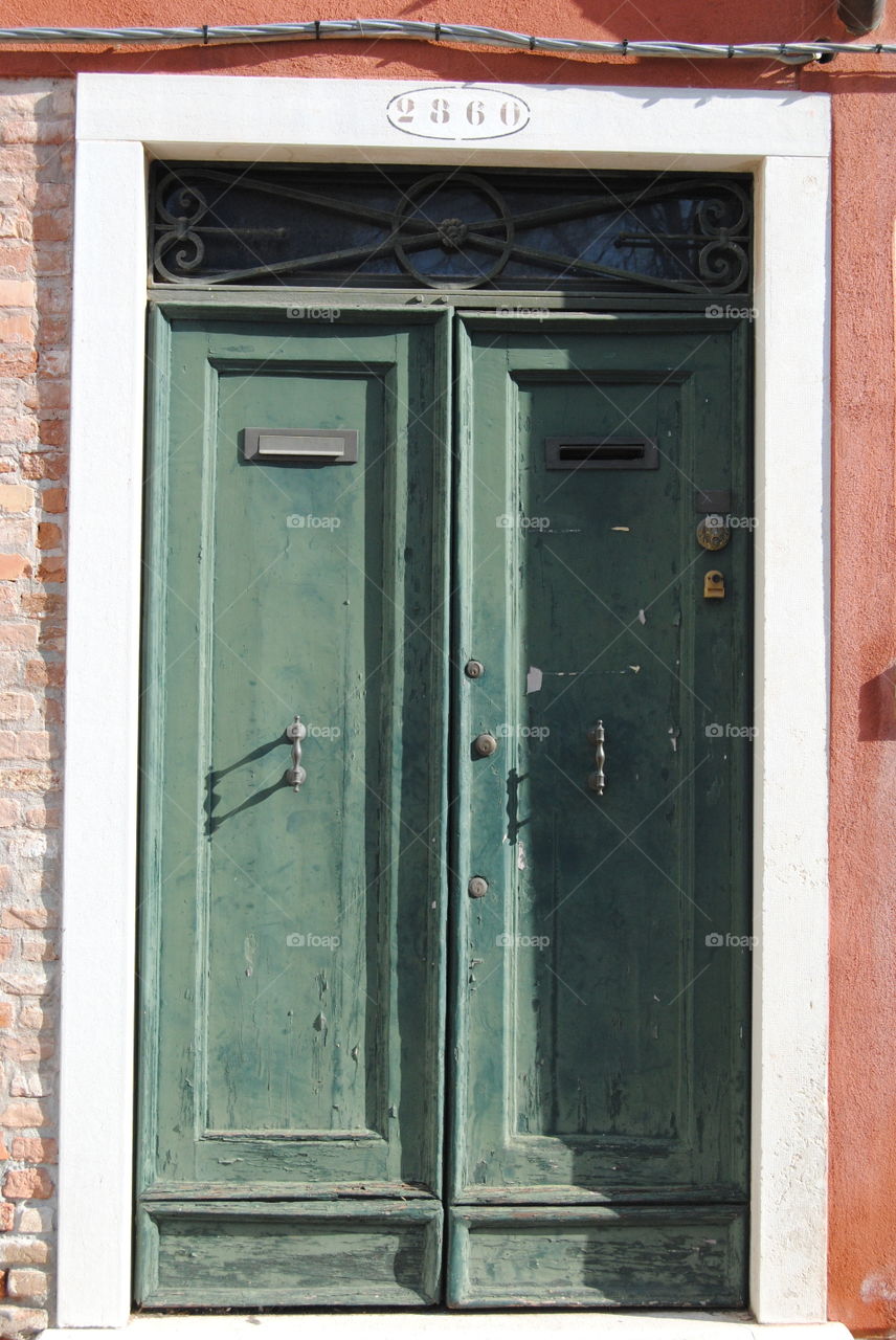 Green vintage doors in Venice Italy 