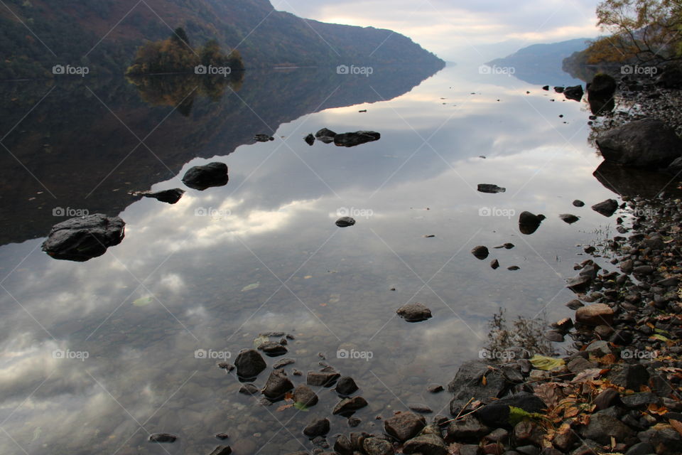 Reflection in the morning light on Loch Lomond in Scotland 