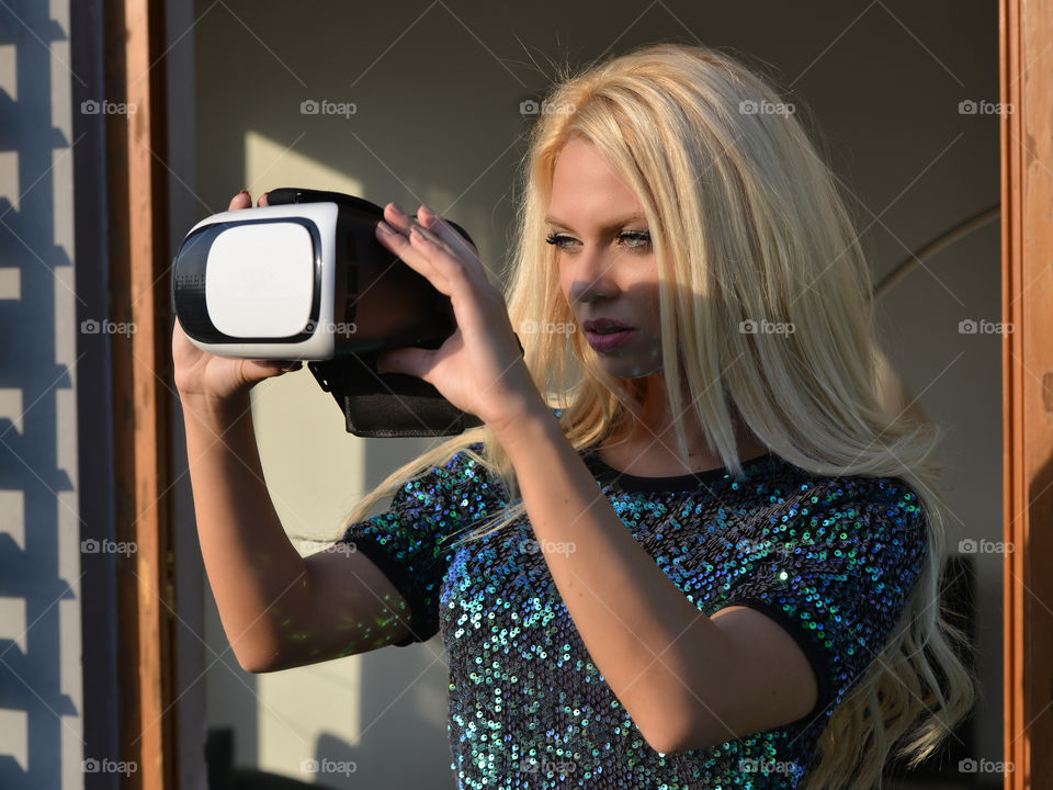 Woman holding virtual camera