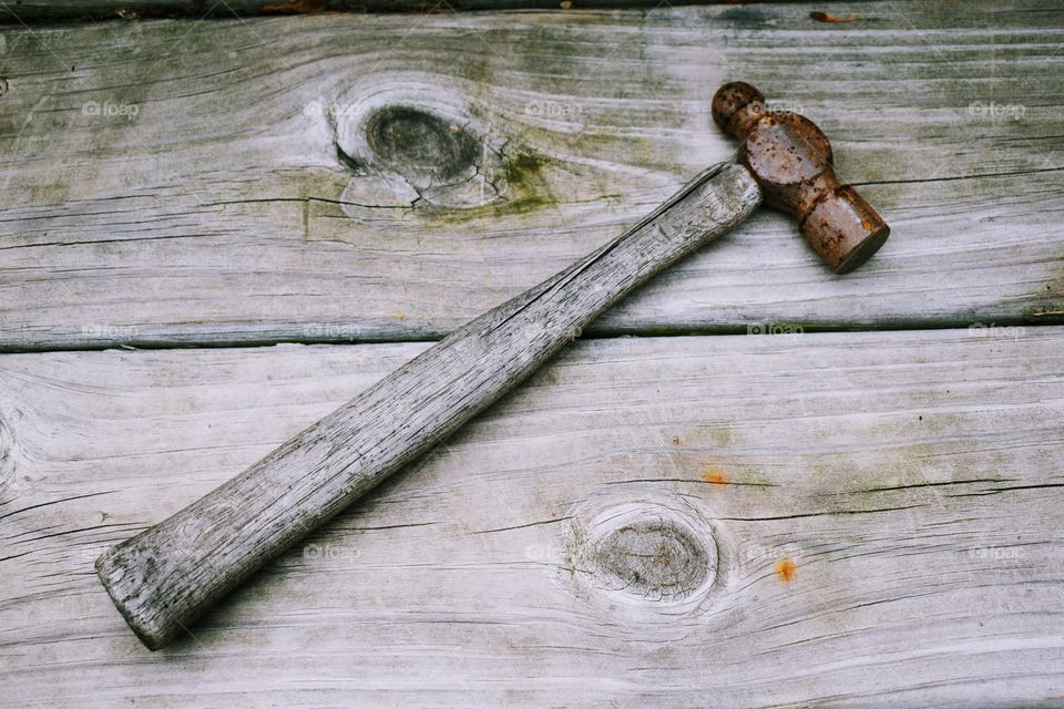 Ball-pene hammer on a wooden deck