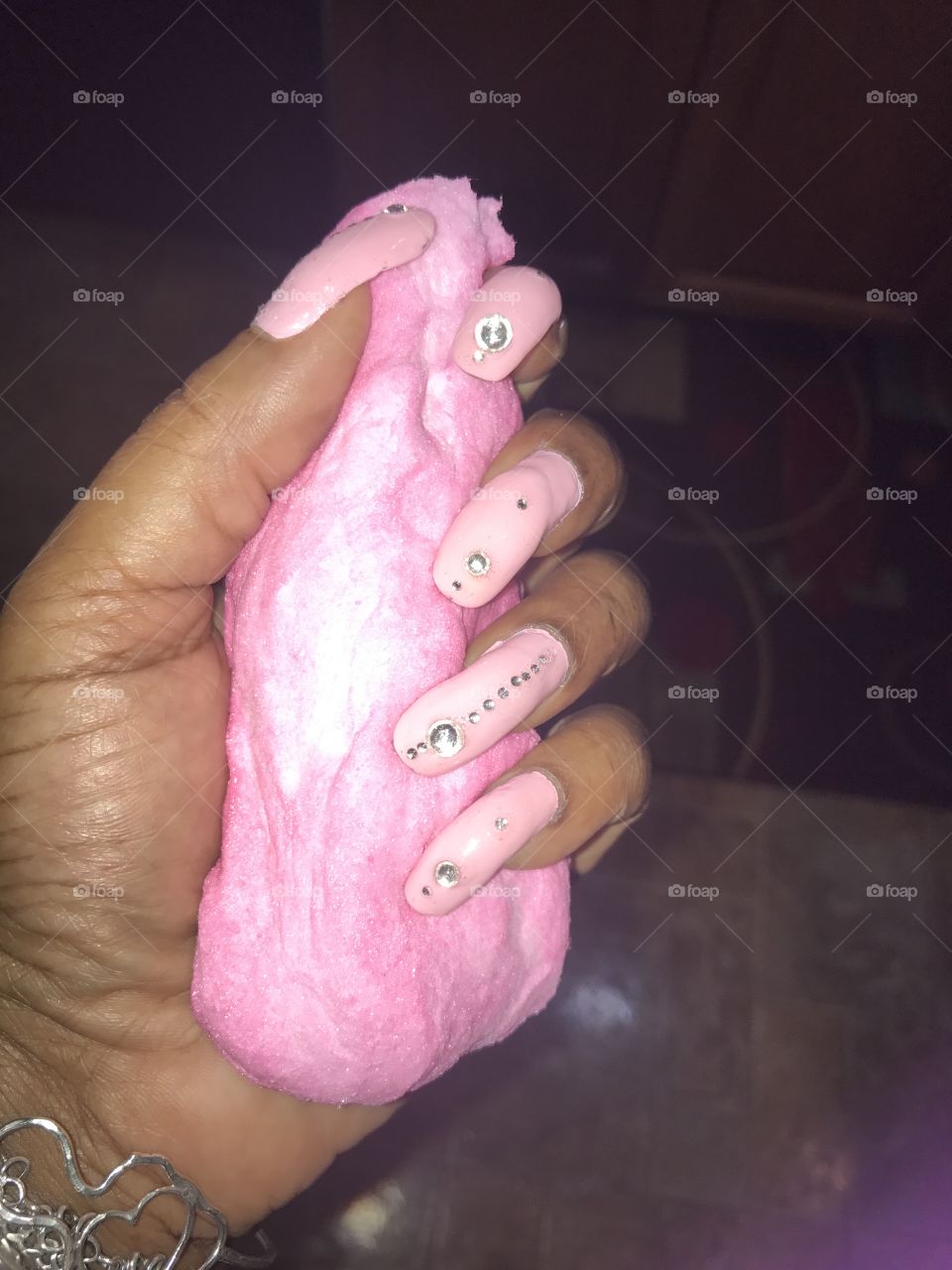 Cotton candy in hand with pink nail designs 