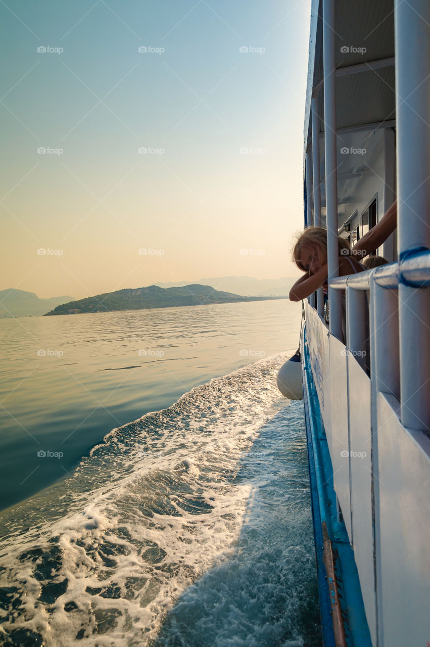 Little girl contemplating her sea voyage.