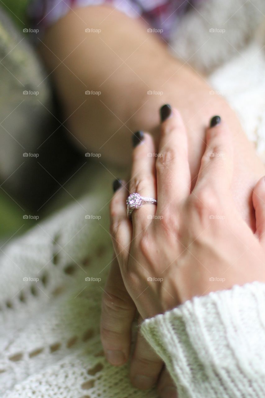 A hand with diamond ring