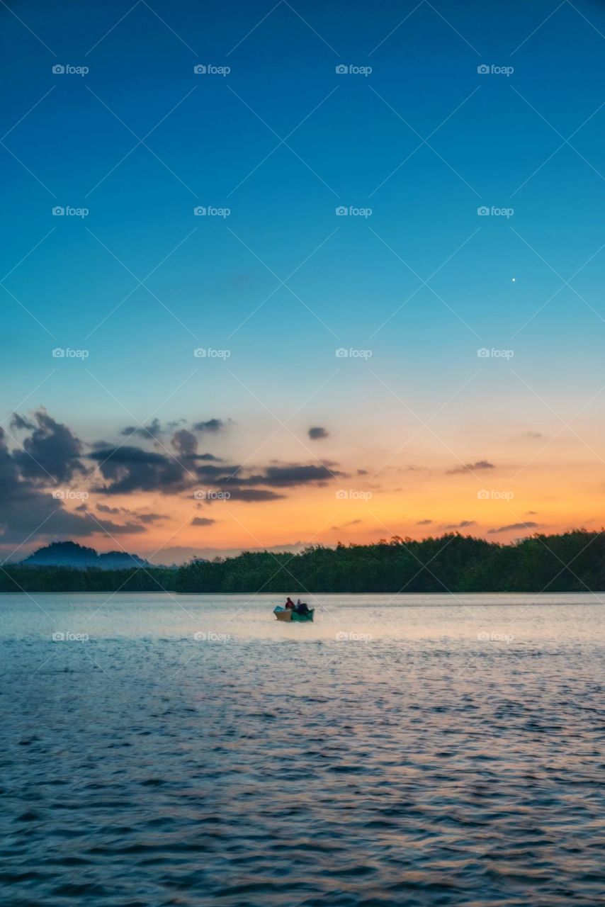 Boat and sea in sunset moment