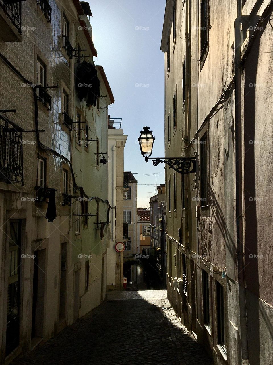 Morning light arriving in narrow street 