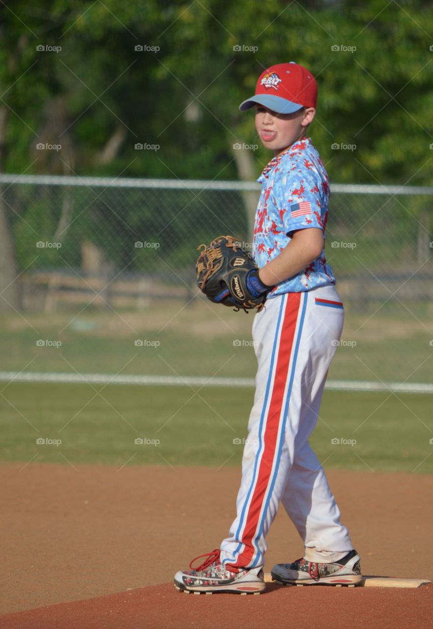 Baseball child player in playground with cap and glove