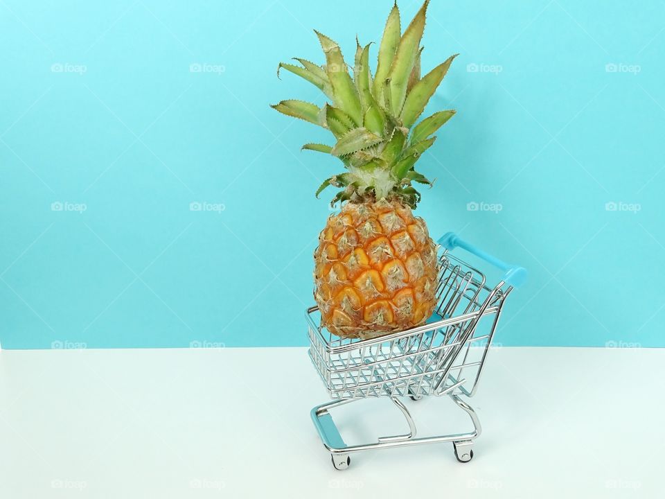 Little pineapple in a shoppingcart