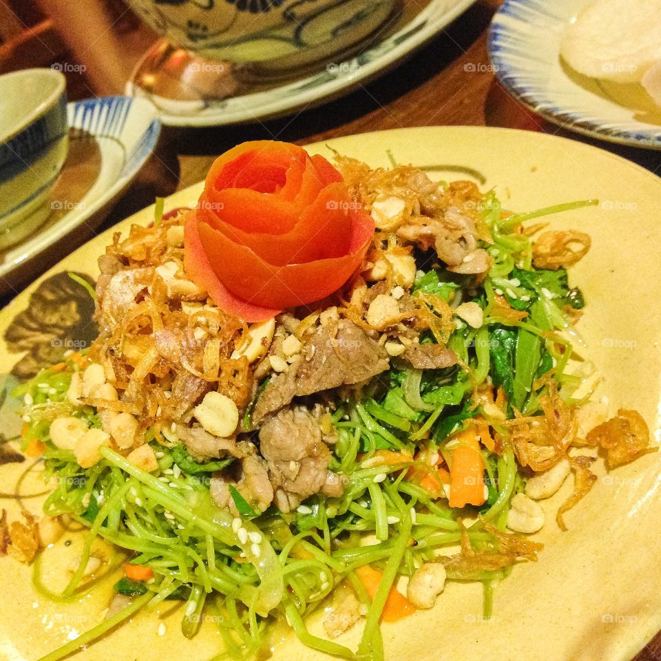 Vietnamese beef in Morning Glory salad and peanuts