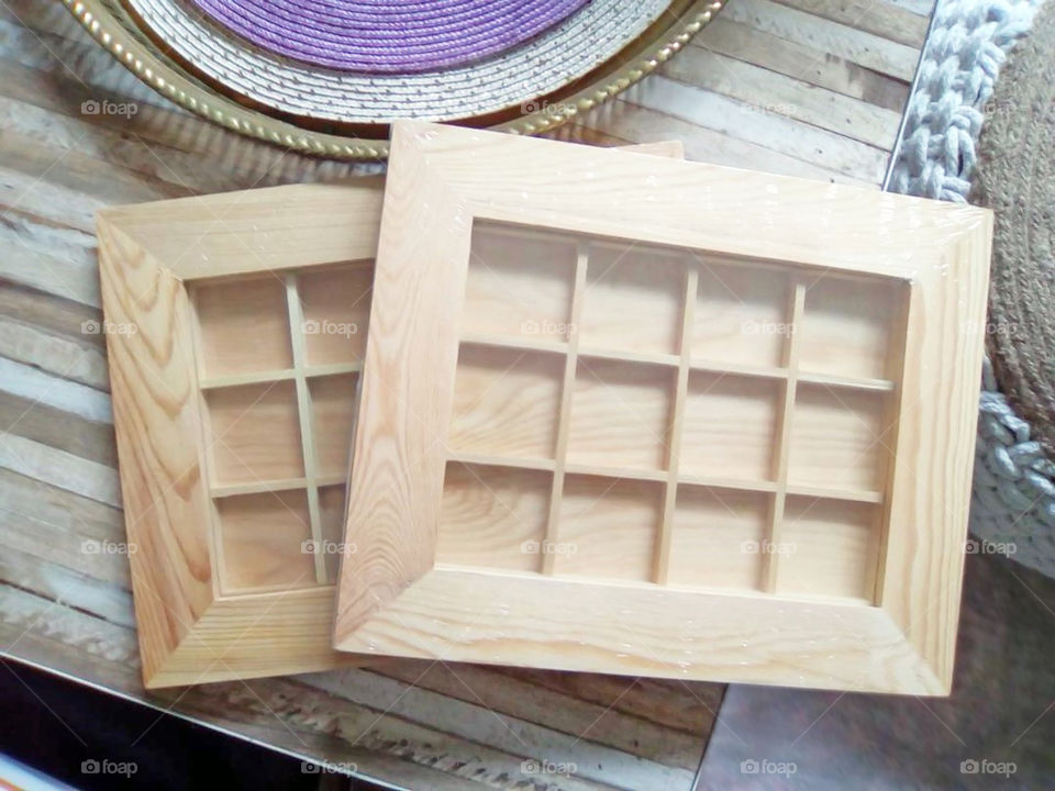 Empty wooden frame on flat lays table