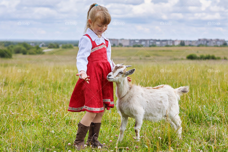 girl with a goat