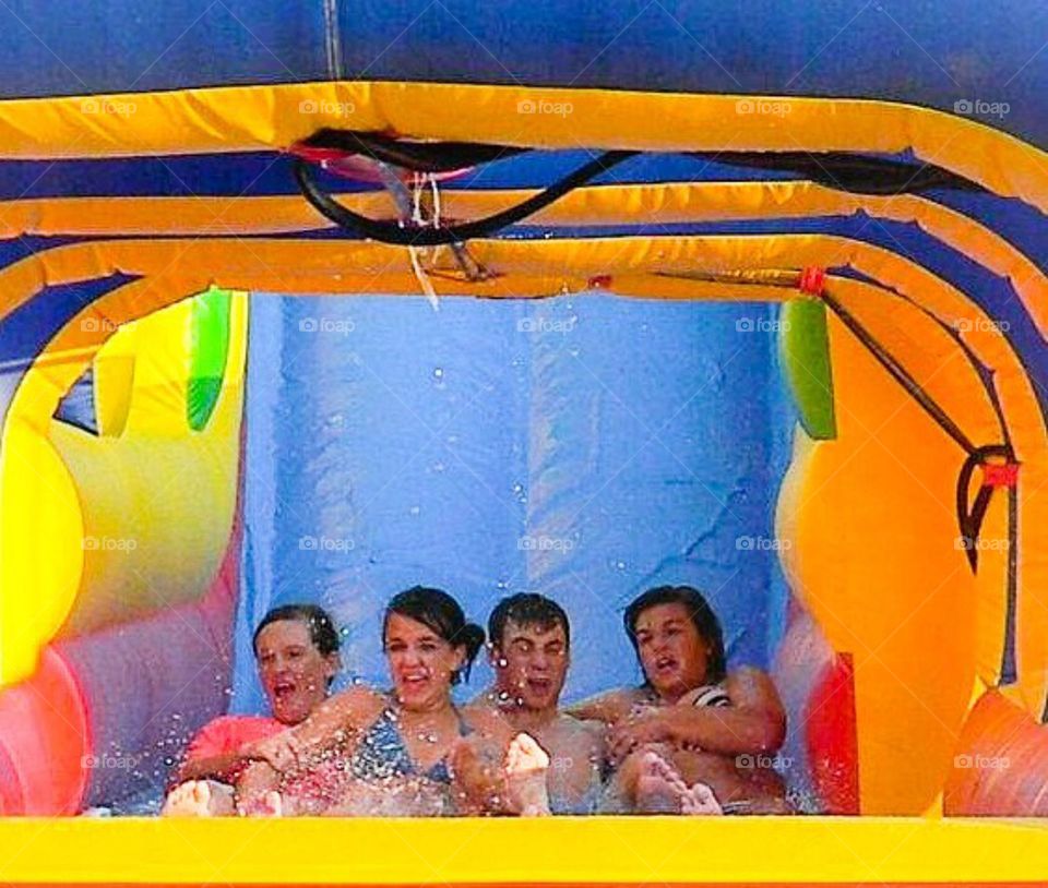 Group of people enjoying ride in waterpark