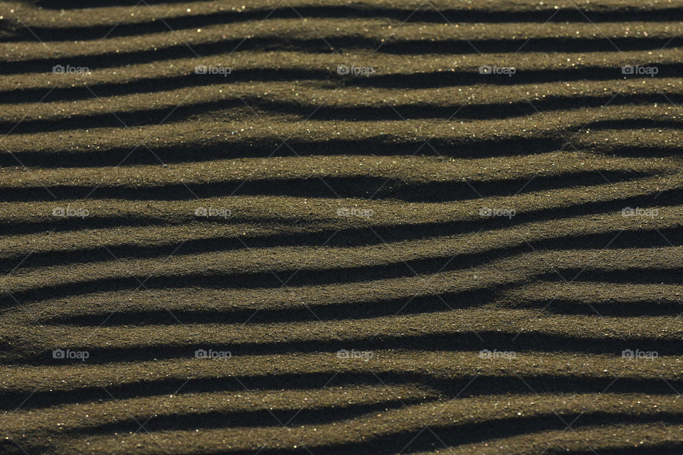 Smooth Flowing Ripple Pattern In Soft Beach Sand