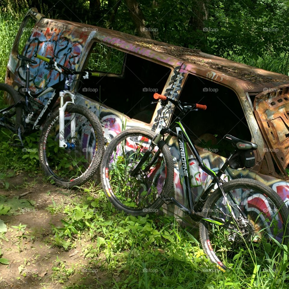 Graffiti van seen while mountain biking.  Would love to know how it got in the middle of the trail.