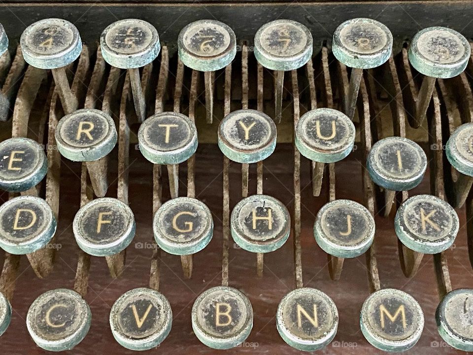A close-up of the keys on an old typewriter