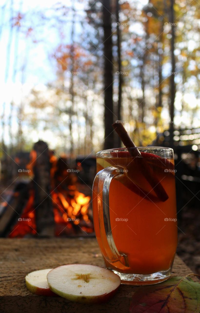 Enjoying homemade apple cider by the fire on a beautiful fall afternoon.