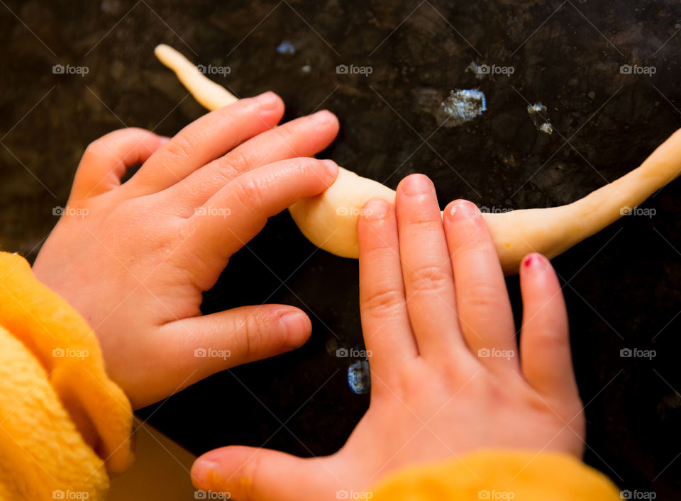 Close-up of child hands playing