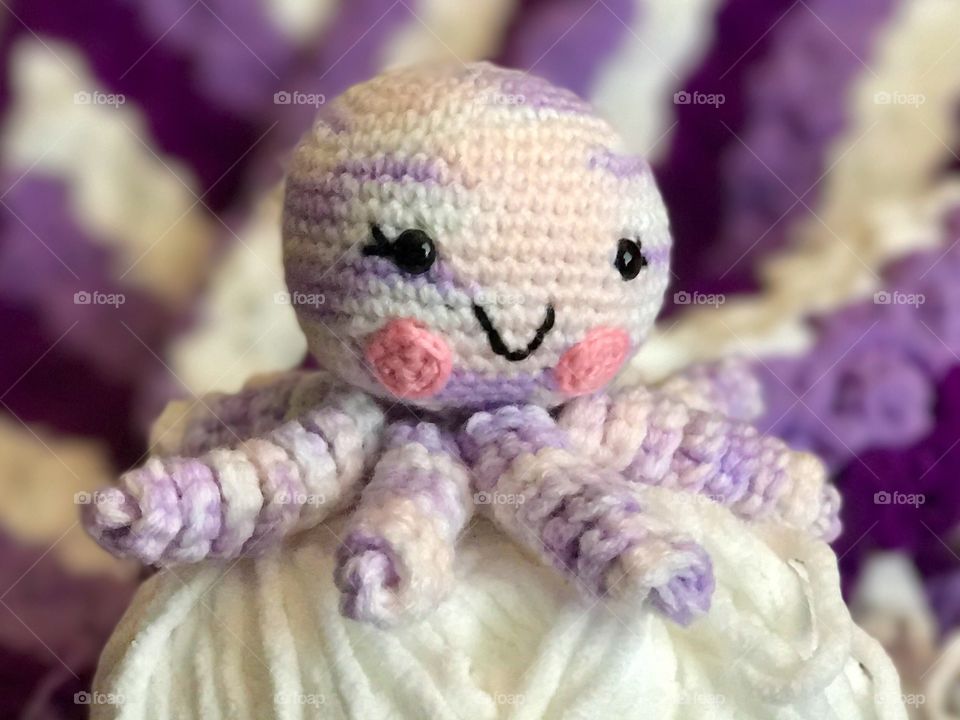 Crocheted Purple Octopus and Yarn