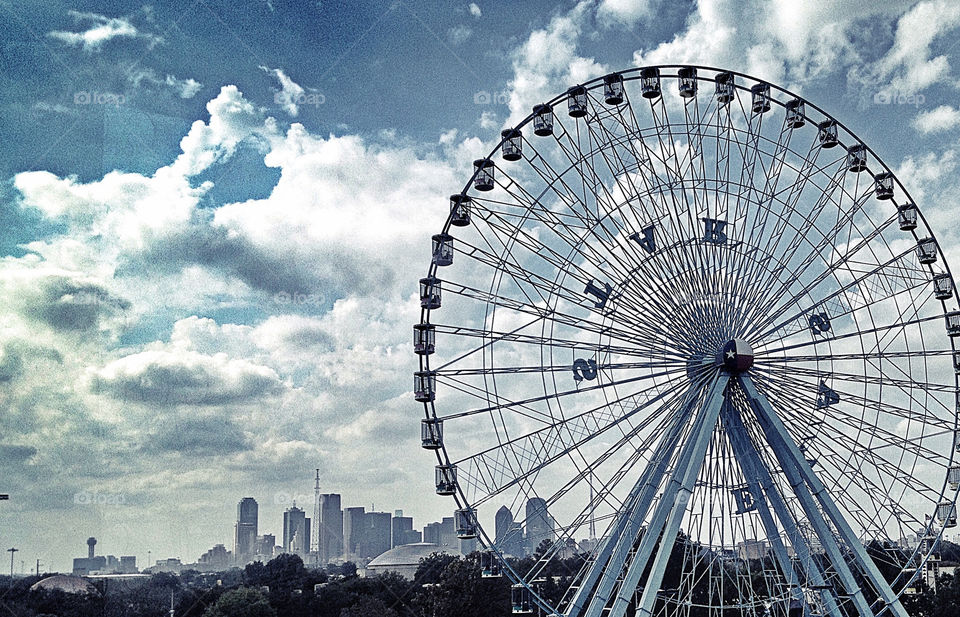 clouds skyline downtown ferris wheel by toxiccheese