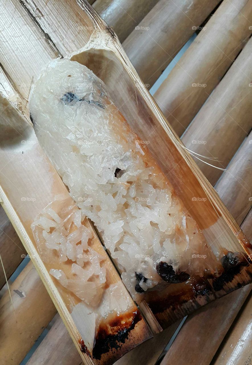 glunous rice baked in bamboo cylinder.