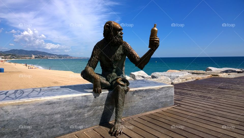 Monkey Sculpture in Badalona. Sculpture designed by Susana Ruiz that represents the Monkey bottle label brand of Anis del Mono factory