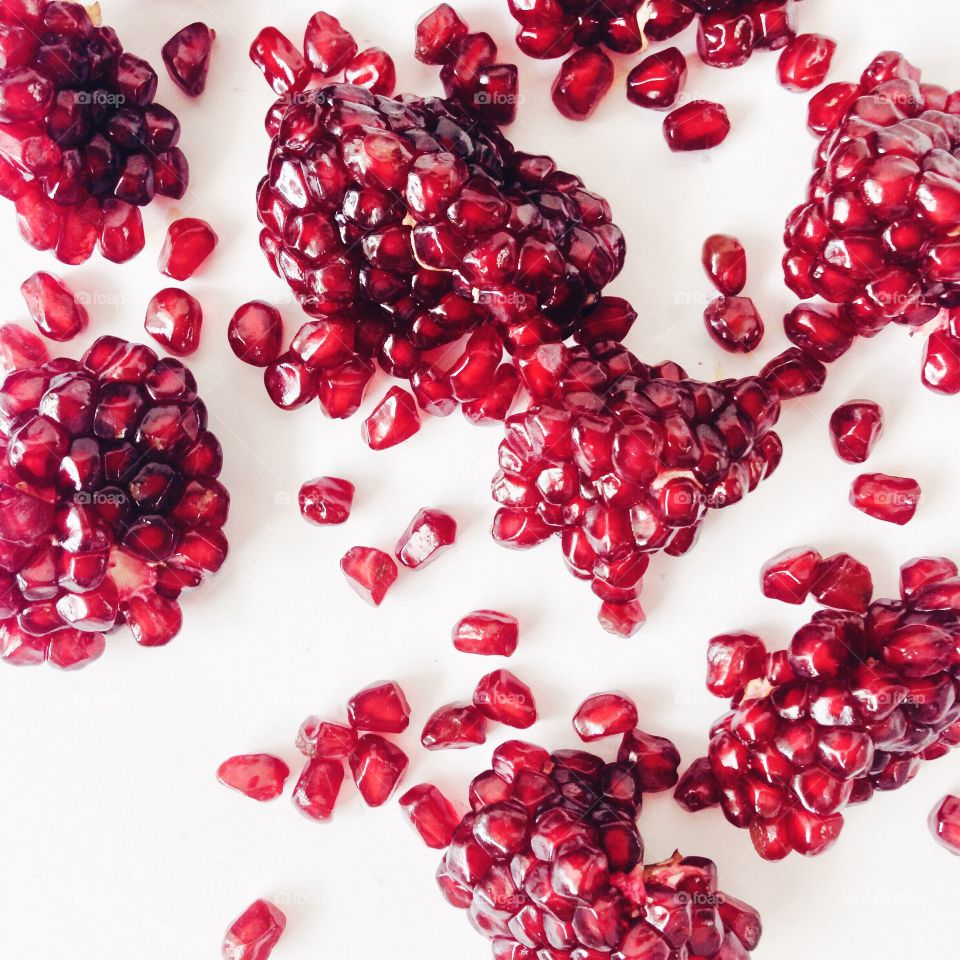 Ripe pomegranate on a white background