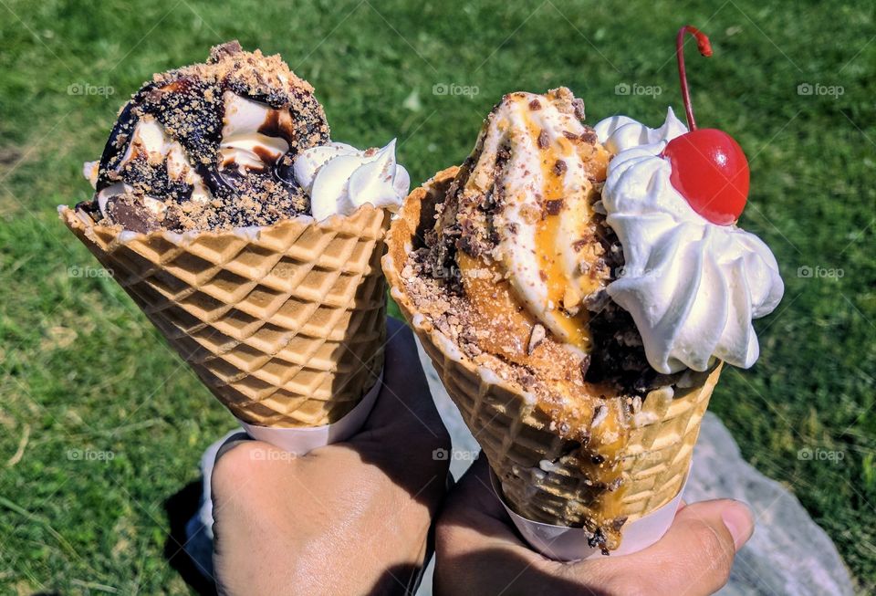 Person's hand holding ice creams