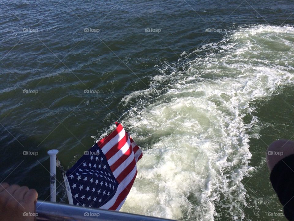 Flush of Water streams across American flag