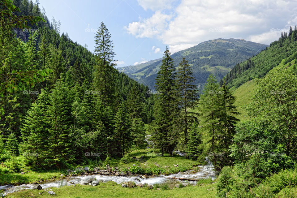 European alps landscape. Stream flowing though Schwarzachtal valley in zillertal alps. Austria.