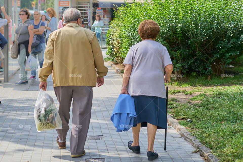 Elderly couple walking